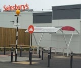 Farnsworth double cycle shelter with custom cycle stand layout and logo for Sainsburys
