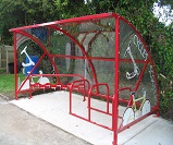 TE06 - Economy shelter configured as a cycle and scooter shelter, with cycle/scooter themed end panels